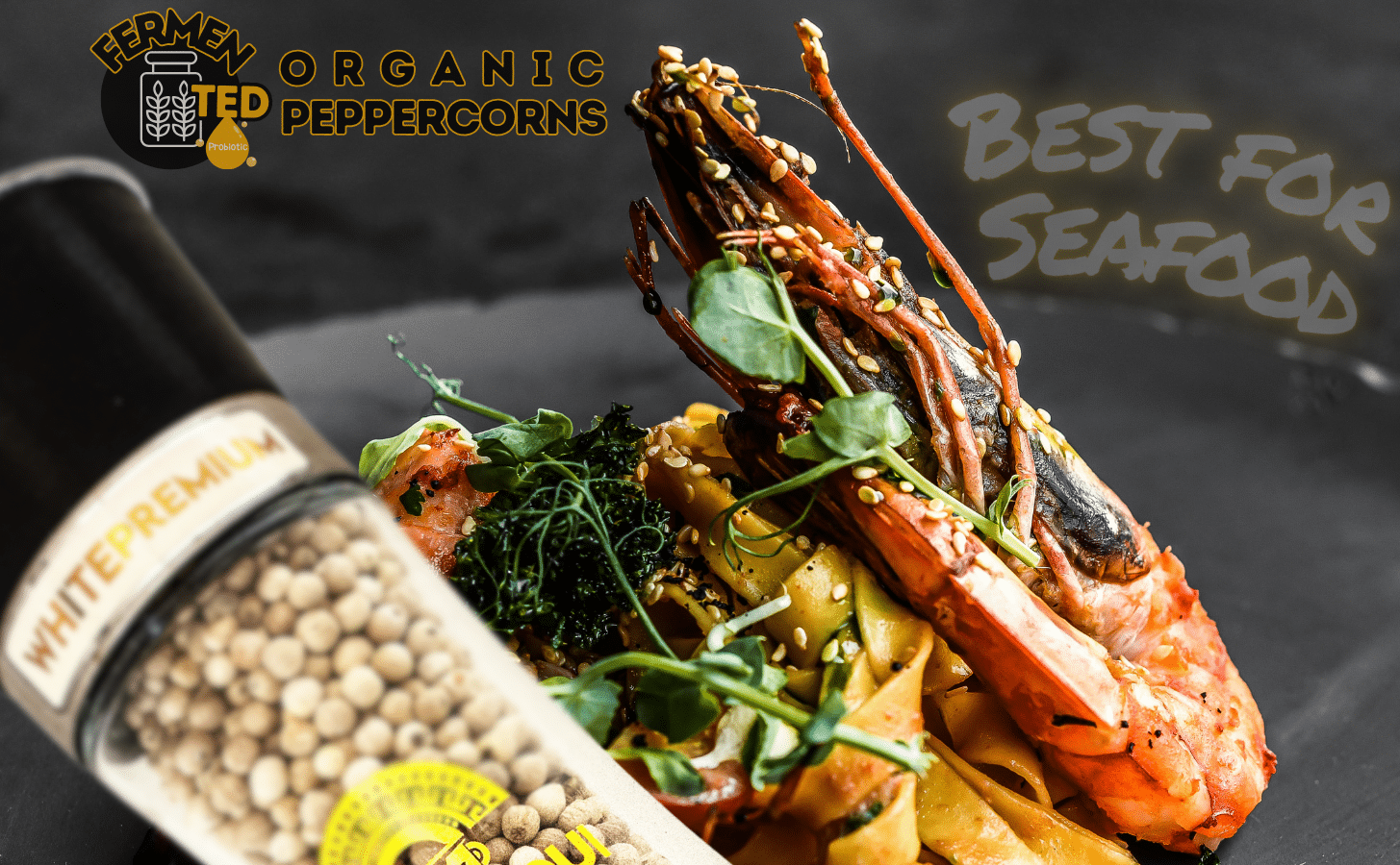 Yupanqui White Premium white peppercorn grinder beside cooked seafood