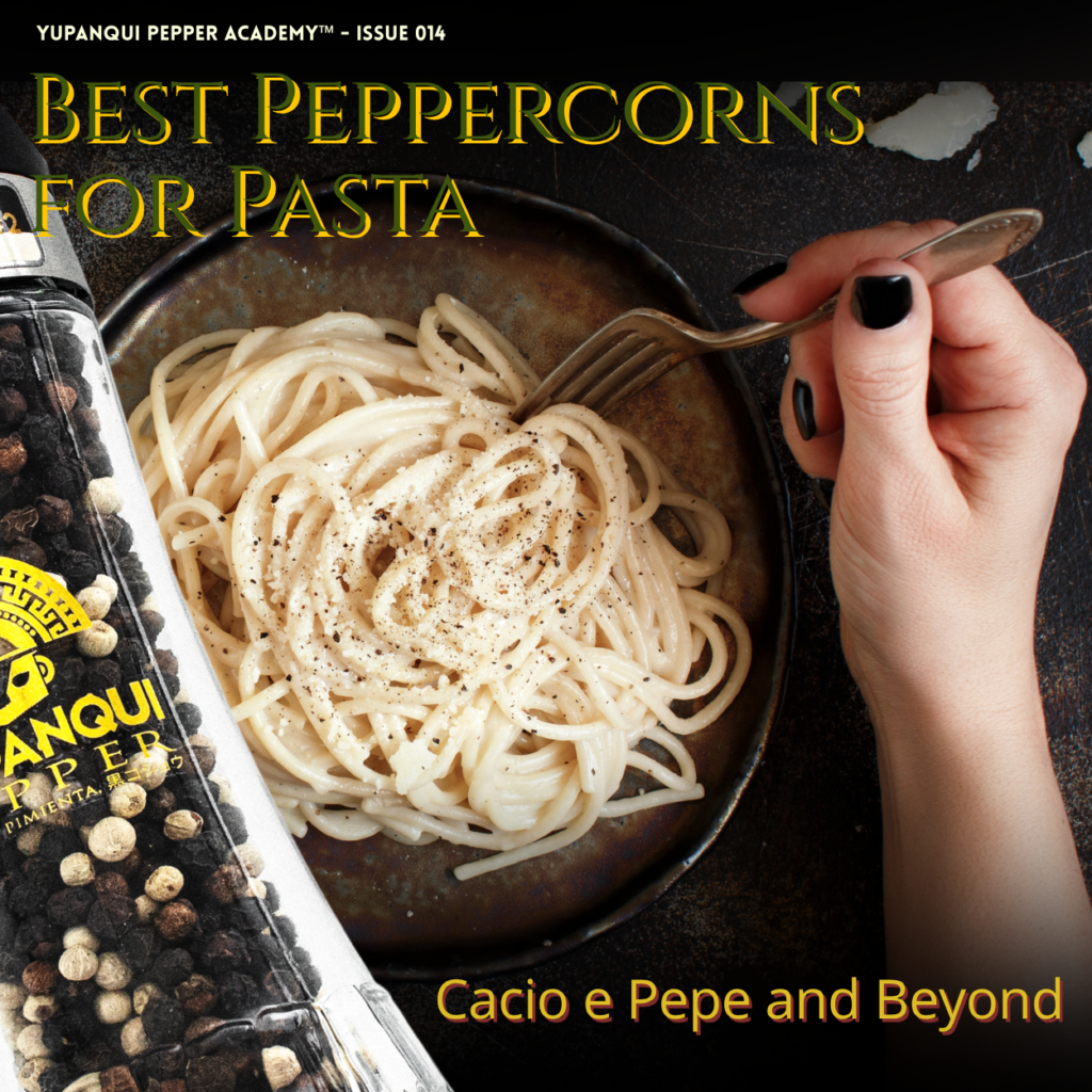 Best peppercorns for pasta: a bowl of creamy pasta beside a Yupanqui black-and-white peppercorn grinder.